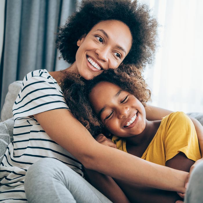 mother and daughter smiling