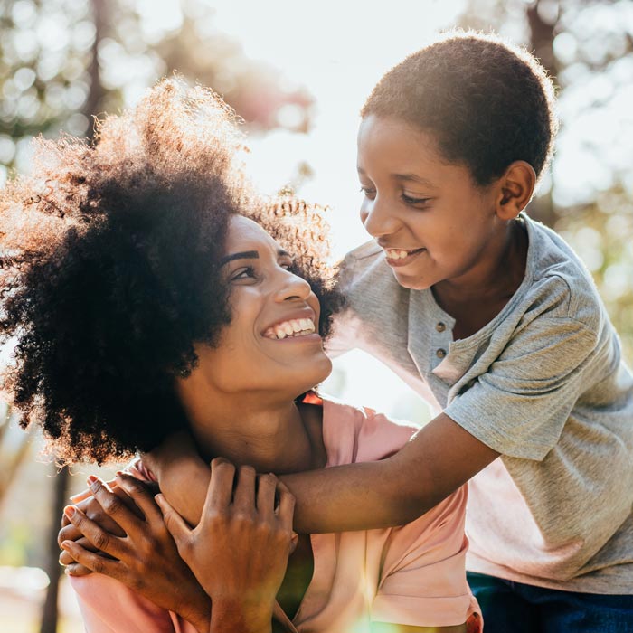 mother and young son smiling