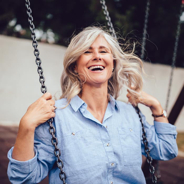 senior aged woman on swing